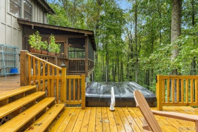 This beautiful, fully furnished, 3-bedroom, 2.5-bath wood cabin on Sapphire National Golf Club in North Carolina - for sale on GolfHomes.com, golf home, golf lot