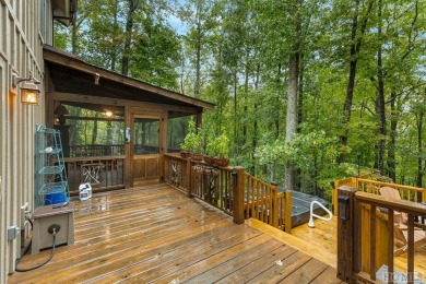 This beautiful, fully furnished, 3-bedroom, 2.5-bath wood cabin on Sapphire National Golf Club in North Carolina - for sale on GolfHomes.com, golf home, golf lot