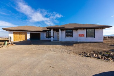 Experience luxury in this newly constructed Redlands masterpiece on The Golf Club At Redlands Mesa in Colorado - for sale on GolfHomes.com, golf home, golf lot