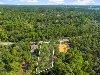 This .5-acre vacant lot is located in the gated Wild Heron on Sharks Tooth Golf Club in Florida - for sale on GolfHomes.com, golf home, golf lot