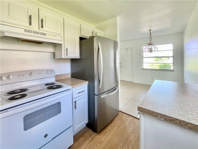 Charming 1st floor corner unit condominium One bedroom one- and on The American Golf Club in Florida - for sale on GolfHomes.com, golf home, golf lot