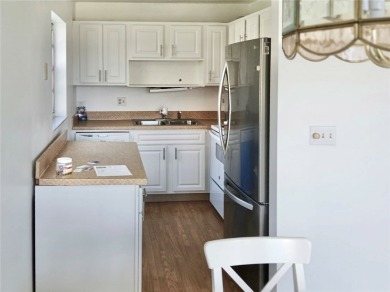 Charming 1st floor corner unit condominium One bedroom one- and on The American Golf Club in Florida - for sale on GolfHomes.com, golf home, golf lot