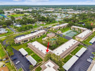 Welcome to this bright corner unit located on the second floor on Largo Golf Course in Florida - for sale on GolfHomes.com, golf home, golf lot