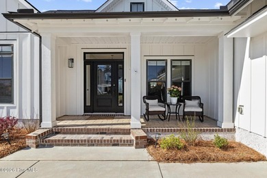 Stunning 3BR/3.5BA Pond-View Home located at The Lakes in on Cape Fear National At Brunswick Forest in North Carolina - for sale on GolfHomes.com, golf home, golf lot