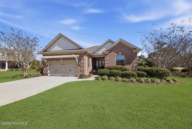 This all-brick home built in 2017 enjoys expansive pond views on Members Club At St. James Plantation in North Carolina - for sale on GolfHomes.com, golf home, golf lot