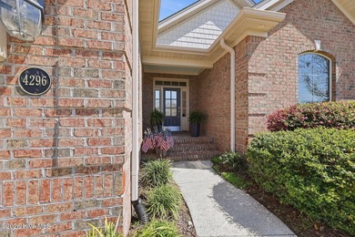 This all-brick home built in 2017 enjoys expansive pond views on Members Club At St. James Plantation in North Carolina - for sale on GolfHomes.com, golf home, golf lot