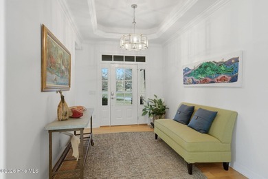 This all-brick home built in 2017 enjoys expansive pond views on Members Club At St. James Plantation in North Carolina - for sale on GolfHomes.com, golf home, golf lot