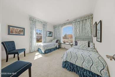 This all-brick home built in 2017 enjoys expansive pond views on Members Club At St. James Plantation in North Carolina - for sale on GolfHomes.com, golf home, golf lot