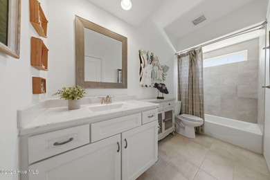 This all-brick home built in 2017 enjoys expansive pond views on Members Club At St. James Plantation in North Carolina - for sale on GolfHomes.com, golf home, golf lot