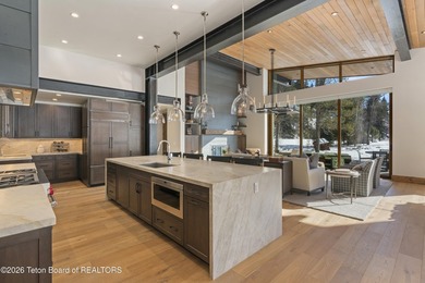 Step into this premier mountain modern home, perfectly sited on on Snake River Sporting Club in Wyoming - for sale on GolfHomes.com, golf home, golf lot