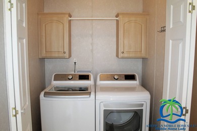 This well-maintained 2014 Nobility Lindsay, owned and occupied on Cypresswood Golf and Country Club in Florida - for sale on GolfHomes.com, golf home, golf lot