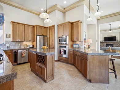 This spacious Mediterranean style patio home in the heart of The on The Golf Club At Redlands Mesa in Colorado - for sale on GolfHomes.com, golf home, golf lot