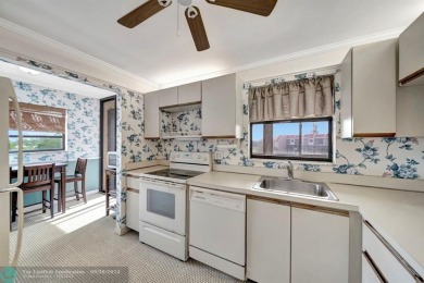SPACIOUS 2/2 PENTHOUSE CORNER UNIT IN MANICURED 55+ LAKES OF on Inverrary Country Club in Florida - for sale on GolfHomes.com, golf home, golf lot