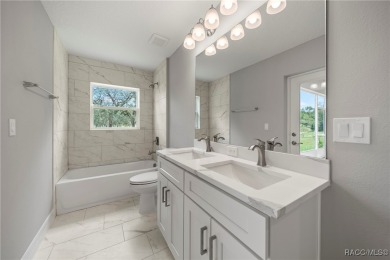 2025 NEW BUILD, this custom updated Genesis Model from Commence on Southern Woods Golf Club in Florida - for sale on GolfHomes.com, golf home, golf lot