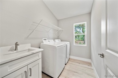 2025 NEW BUILD, this custom updated Genesis Model from Commence on Southern Woods Golf Club in Florida - for sale on GolfHomes.com, golf home, golf lot