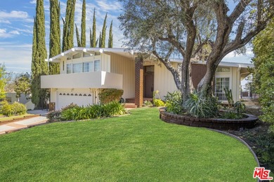 Golf Course & City Views! Perched in a prime Tarzana hillside on Braemar Country Club in California - for sale on GolfHomes.com, golf home, golf lot