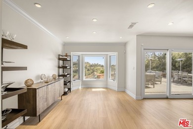 Golf Course & City Views! Perched in a prime Tarzana hillside on Braemar Country Club in California - for sale on GolfHomes.com, golf home, golf lot