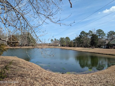 A must-see, beautiful 0.30-acre wooded homesite located in the on River Landing Golf Course in North Carolina - for sale on GolfHomes.com, golf home, golf lot