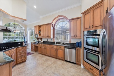 This executive pool home is located on a quiet cul de sac street on Heathrow Country Club in Florida - for sale on GolfHomes.com, golf home, golf lot