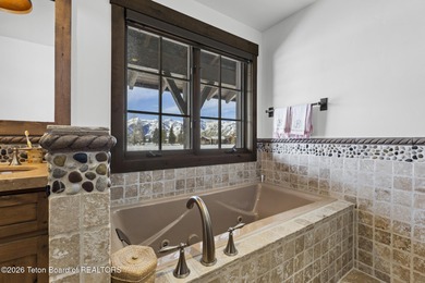 This charming home is a great opportunity to own in the Cabins on Jackson Hole Golf and Tennis Club in Wyoming - for sale on GolfHomes.com, golf home, golf lot