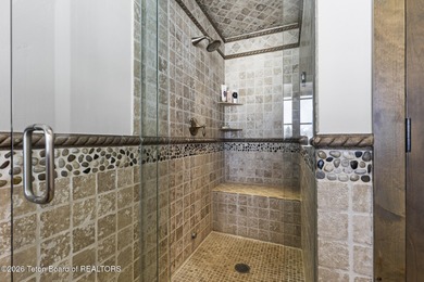 This charming home is a great opportunity to own in the Cabins on Jackson Hole Golf and Tennis Club in Wyoming - for sale on GolfHomes.com, golf home, golf lot