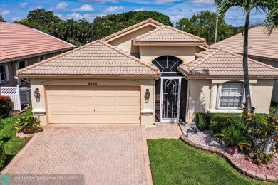 Welcome to this stunning home in a gated community and golfer's on Westchester Golf and Country Club in Florida - for sale on GolfHomes.com, golf home, golf lot