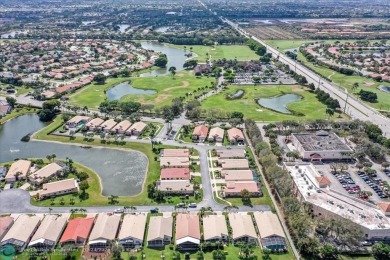 Welcome to this stunning home in a gated community and golfer's on Westchester Golf and Country Club in Florida - for sale on GolfHomes.com, golf home, golf lot