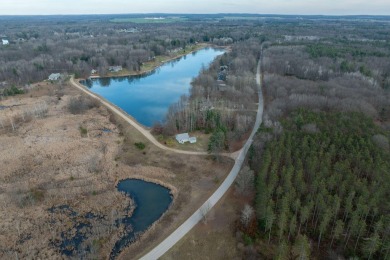 Rare Find!  Over 1 acre + 200' Waterfrontage on Fawn Lake on Canadian Lakes Country Club-The Royal Course in Michigan - for sale on GolfHomes.com, golf home, golf lot