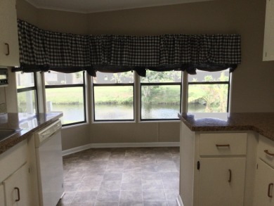 Great view from the kitchen and living room of this nicely on Spanish Lakes I in Florida - for sale on GolfHomes.com, golf home, golf lot