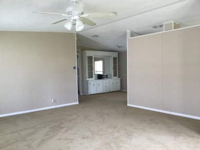 Great view from the kitchen and living room of this nicely on Spanish Lakes I in Florida - for sale on GolfHomes.com, golf home, golf lot