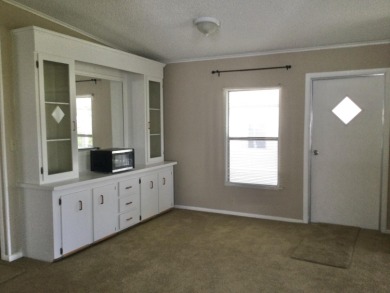 Great view from the kitchen and living room of this nicely on Spanish Lakes I in Florida - for sale on GolfHomes.com, golf home, golf lot