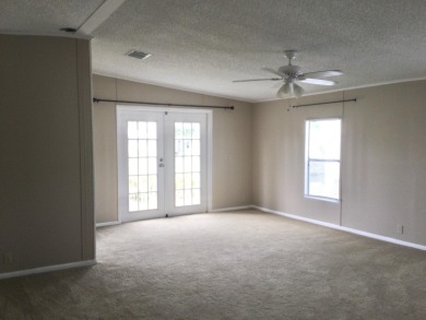 Great view from the kitchen and living room of this nicely on Spanish Lakes I in Florida - for sale on GolfHomes.com, golf home, golf lot