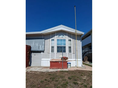 Furnished park model on .08 acre lot. Built in 1998 with an 18 on Deer Creek RV Golf Resort in Florida - for sale on GolfHomes.com, golf home, golf lot