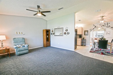 This beautifully updated expanded pecan model in Spruce Creek on The Links of Spruce Creek in Florida - for sale on GolfHomes.com, golf home, golf lot