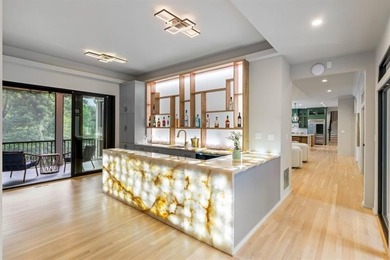 Set at the quiet end of an exclusive cul-de-sac, beyond a secure on Bobby Jones Golf Club in Georgia - for sale on GolfHomes.com, golf home, golf lot