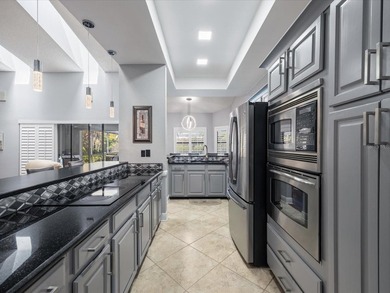 Tucked away on a quiet cul-de-sac, this exceptional on East Lake Woodlands Country Club in Florida - for sale on GolfHomes.com, golf home, golf lot