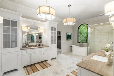 Set at the quiet end of an exclusive cul-de-sac, beyond a secure on Bobby Jones Golf Club in Georgia - for sale on GolfHomes.com, golf home, golf lot