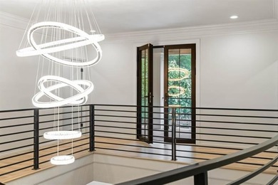 Set at the quiet end of an exclusive cul-de-sac, beyond a secure on Bobby Jones Golf Club in Georgia - for sale on GolfHomes.com, golf home, golf lot