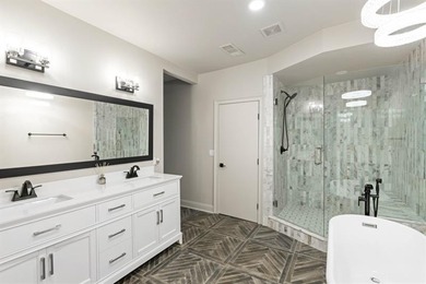 Set at the quiet end of an exclusive cul-de-sac, beyond a secure on Bobby Jones Golf Club in Georgia - for sale on GolfHomes.com, golf home, golf lot