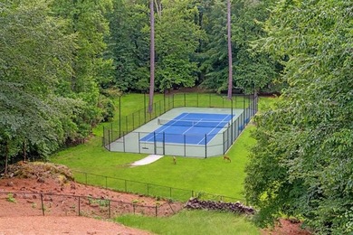 Set at the quiet end of an exclusive cul-de-sac, beyond a secure on Bobby Jones Golf Club in Georgia - for sale on GolfHomes.com, golf home, golf lot