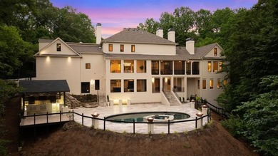 Set at the quiet end of an exclusive cul-de-sac, beyond a secure on Bobby Jones Golf Club in Georgia - for sale on GolfHomes.com, golf home, golf lot