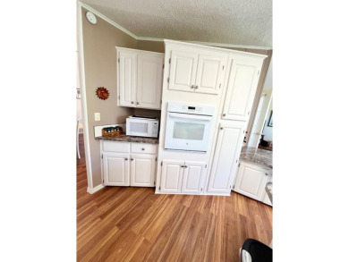 If you're looking for a beautifully maintained, move-in-ready on Pine Lakes Country Club in Florida - for sale on GolfHomes.com, golf home, golf lot