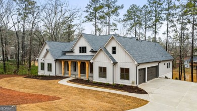 Relax and gaze upon the peaceful water view of this interior on Harbor Club Golf and Country Club in Georgia - for sale on GolfHomes.com, golf home, golf lot