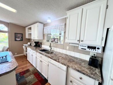 If you're looking for a beautifully maintained, move-in-ready on Pine Lakes Country Club in Florida - for sale on GolfHomes.com, golf home, golf lot