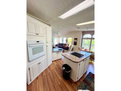 If you're looking for a beautifully maintained, move-in-ready on Pine Lakes Country Club in Florida - for sale on GolfHomes.com, golf home, golf lot