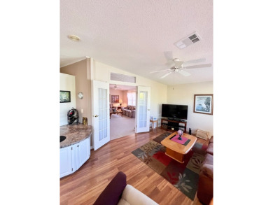 If you're looking for a beautifully maintained, move-in-ready on Pine Lakes Country Club in Florida - for sale on GolfHomes.com, golf home, golf lot