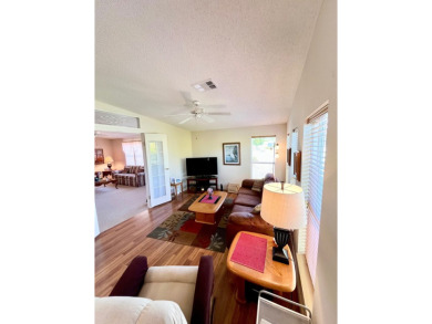 If you're looking for a beautifully maintained, move-in-ready on Pine Lakes Country Club in Florida - for sale on GolfHomes.com, golf home, golf lot