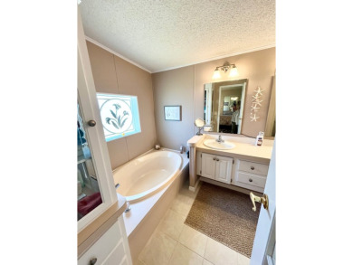If you're looking for a beautifully maintained, move-in-ready on Pine Lakes Country Club in Florida - for sale on GolfHomes.com, golf home, golf lot