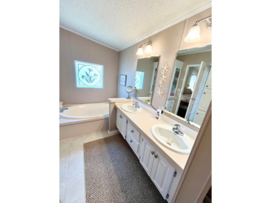 If you're looking for a beautifully maintained, move-in-ready on Pine Lakes Country Club in Florida - for sale on GolfHomes.com, golf home, golf lot