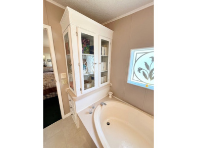 If you're looking for a beautifully maintained, move-in-ready on Pine Lakes Country Club in Florida - for sale on GolfHomes.com, golf home, golf lot